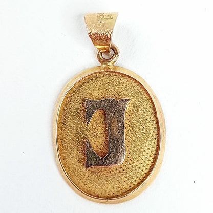 Kultainen J kirjainriipus