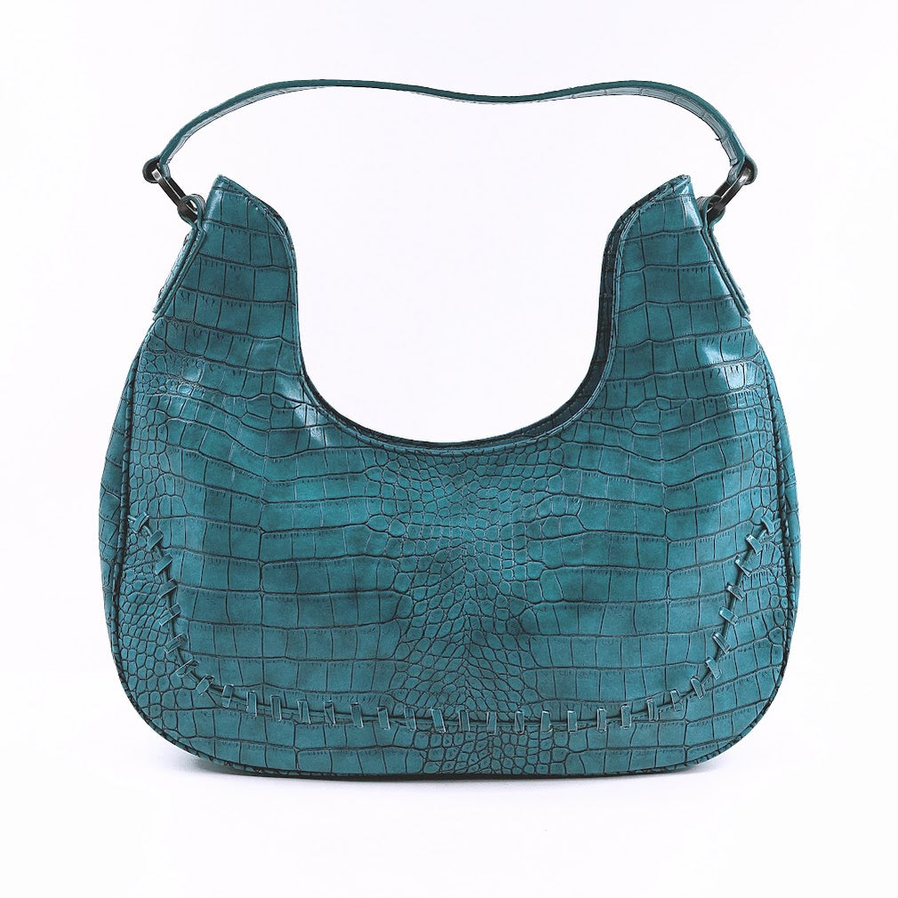 Paris Hilton turkoosi laukku