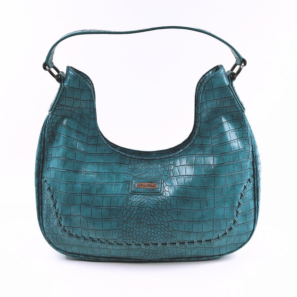 Paris Hilton turkoosi laukku