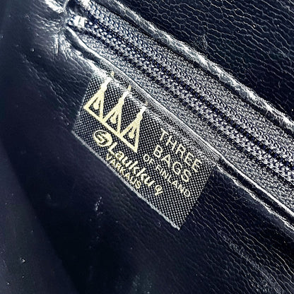 Three Bags vintage nahkalaukku rannehihnalla