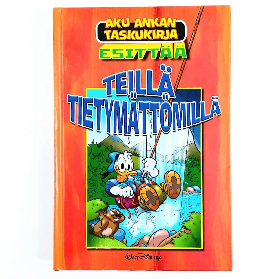 Kirja Aku Ankan taskukirja esittää Teillä tietymättömillä